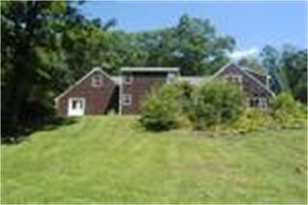 41 Frye Road Bolton, MA 01740 - Photo 22 of 24 a view of a brick house with a yard