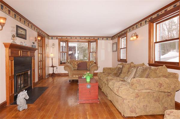 41 Frye Road Bolton, MA 01740 - Photo 3 of 24 a living room with furniture large window and wooden floor