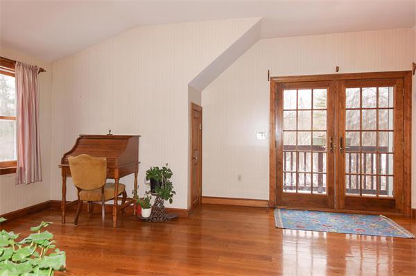 41 Frye Road Bolton, MA 01740 - Photo 8 of 24 a living room with furniture and a large window