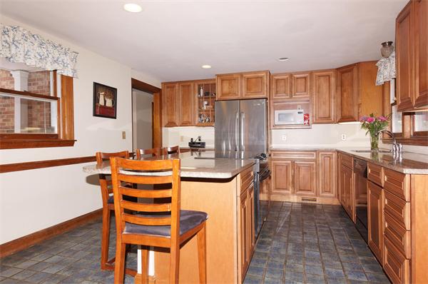 41 Frye Road Bolton, MA 01740 - Photo 10 of 24 a kitchen with stainless steel appliances a refrigerator and a stove top oven