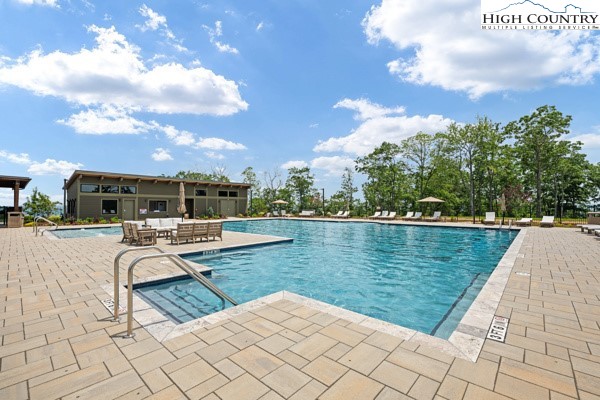 Lot 99 Nightshade Road Boone, NC 28607 - Photo 23 of 24 a view of a lake with couches chairs