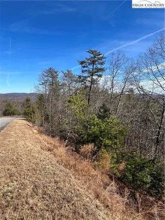 a patio with water view fountain and outdoor seating