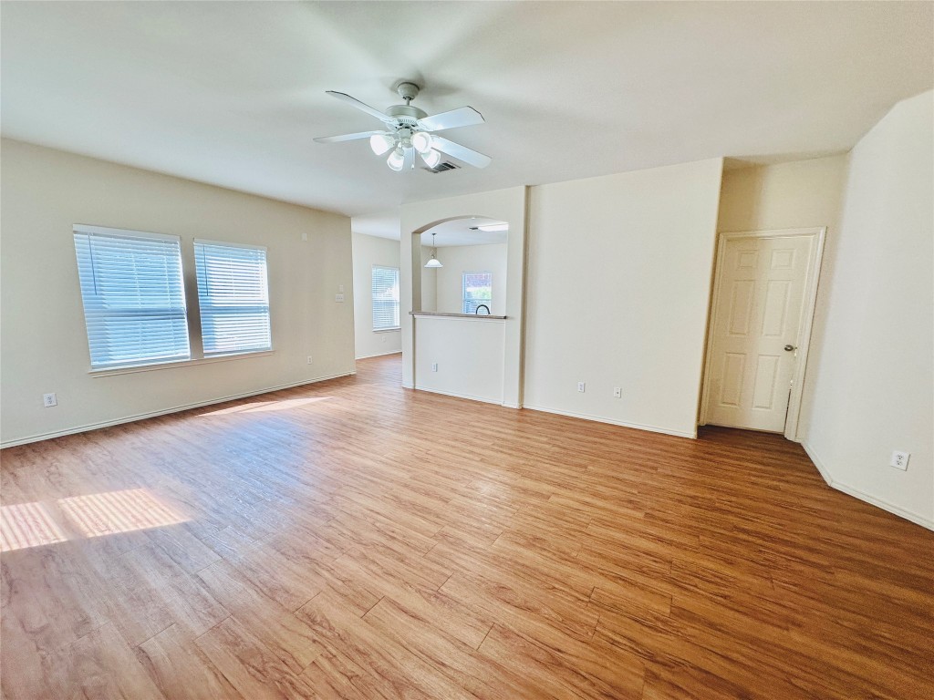 2205 Boyds Way Austin, TX 78748 - Photo 16 of 40 a view of an empty room with wooden floor and fan