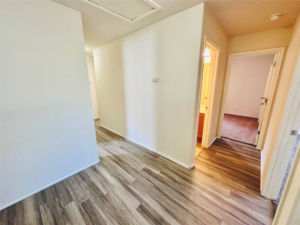 2205 Boyds Way Austin, TX 78748 - Photo 17 of 40 a view of a room with wooden floor and door