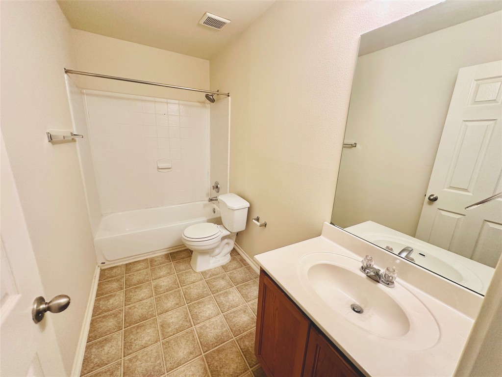 2205 Boyds Way Austin, TX 78748 - Photo 25 of 40 a bathroom with a sink toilet and shower