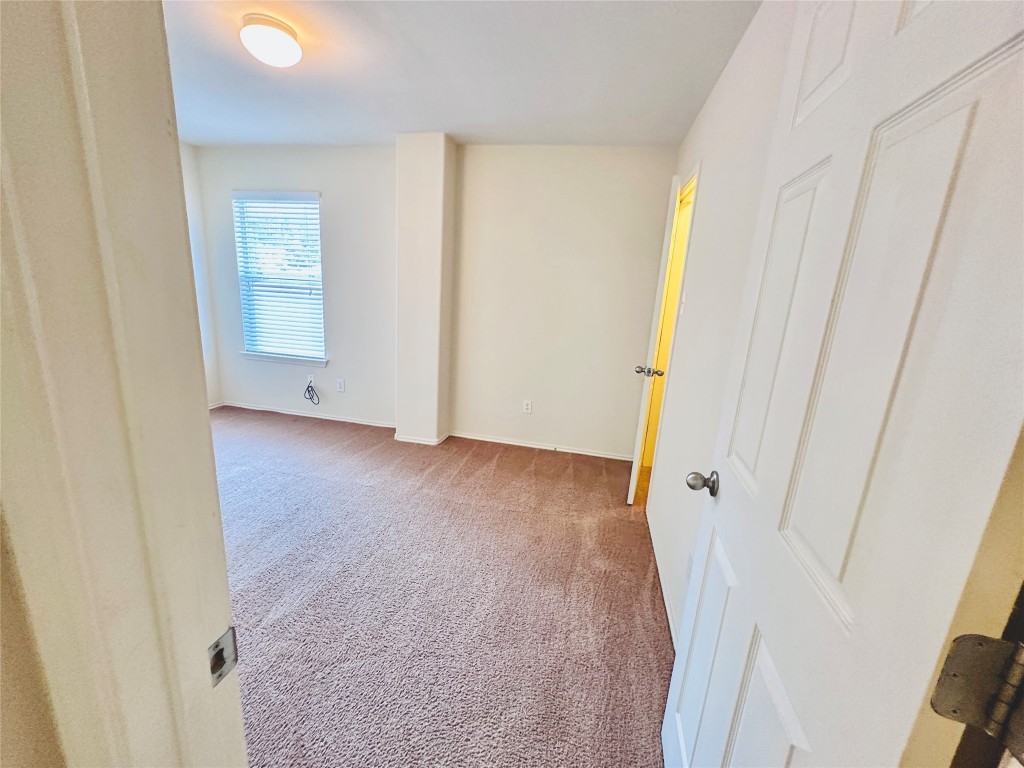 2205 Boyds Way Austin, TX 78748 - Photo 26 of 40 a view of an empty room with wooden floor and closet