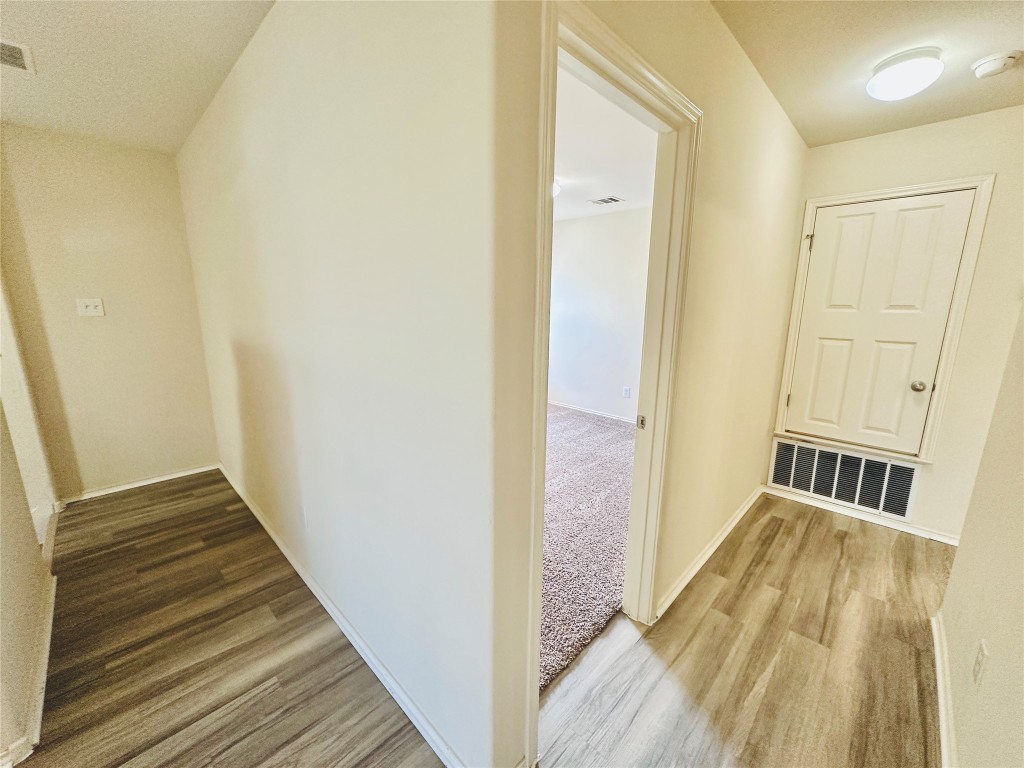2205 Boyds Way Austin, TX 78748 - Photo 30 of 40 a view of a hallway with wooden floor and staircase