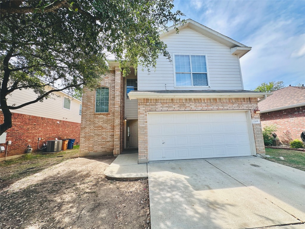 2205 Boyds Way Austin, TX 78748 - Photo 3 of 40 a view of a house with a yard and garage