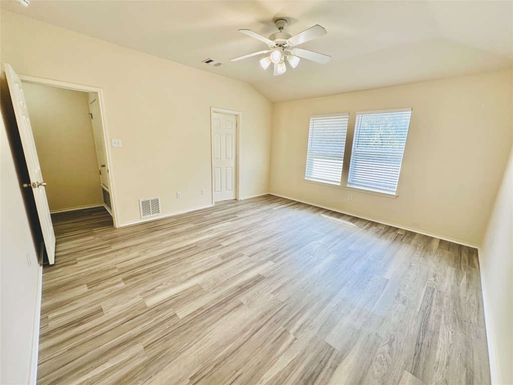 2205 Boyds Way Austin, TX 78748 - Photo 35 of 40 a view of an empty room with a window and wooden floor
