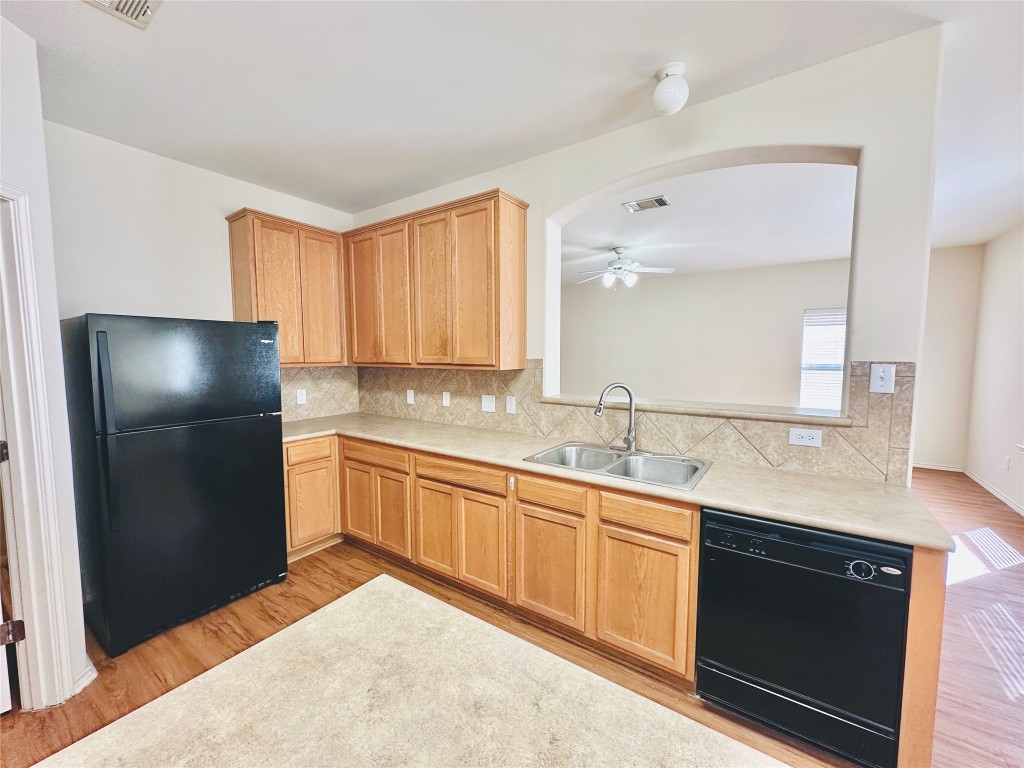 2205 Boyds Way Austin, TX 78748 - Photo 10 of 40 a kitchen with a sink appliances and cabinets