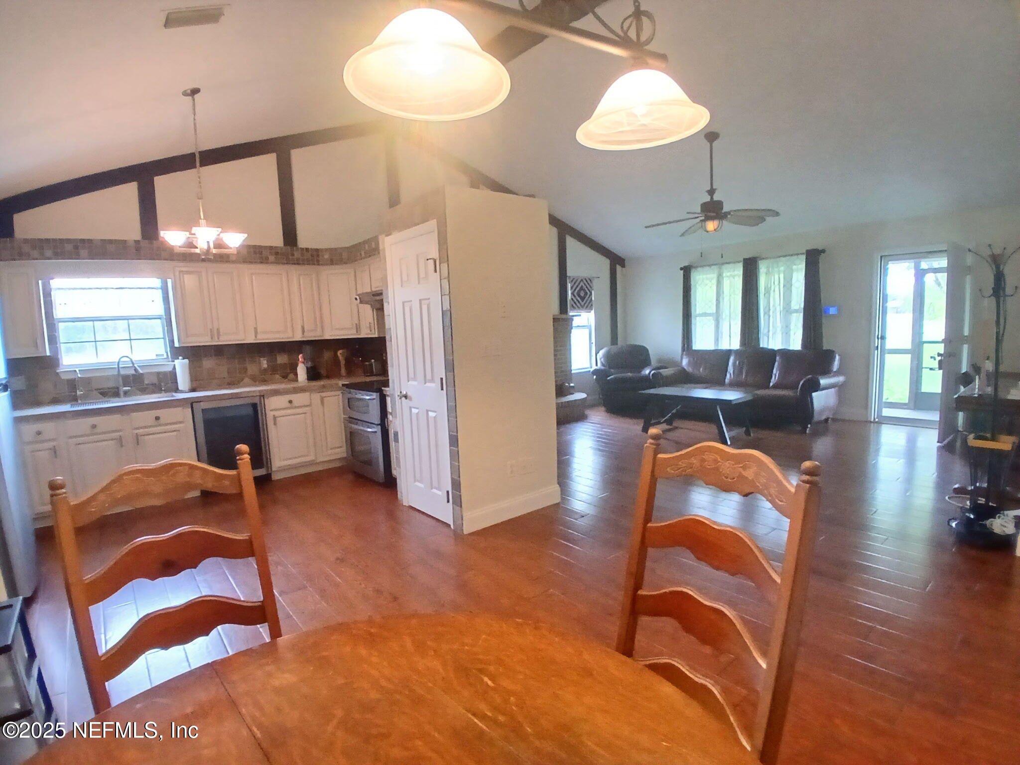 8905 Reid Packing House Road Hastings, FL 32145 - Photo 11 of 40 a view of a kitchen and dining room