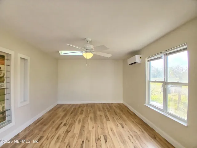 an empty room with a empty space and a window