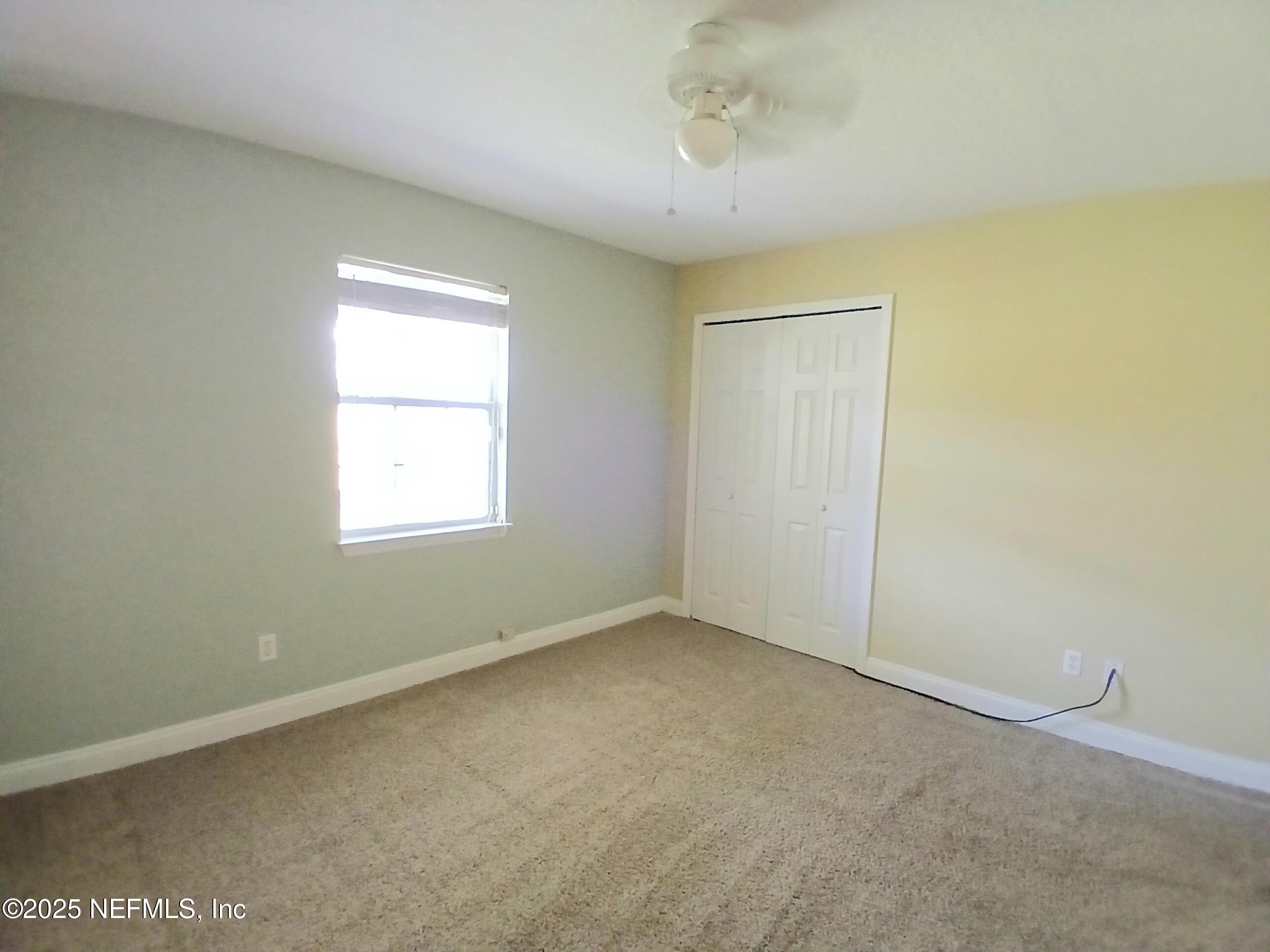 8905 Reid Packing House Road Hastings, FL 32145 - Photo 20 of 40 an empty room with a window