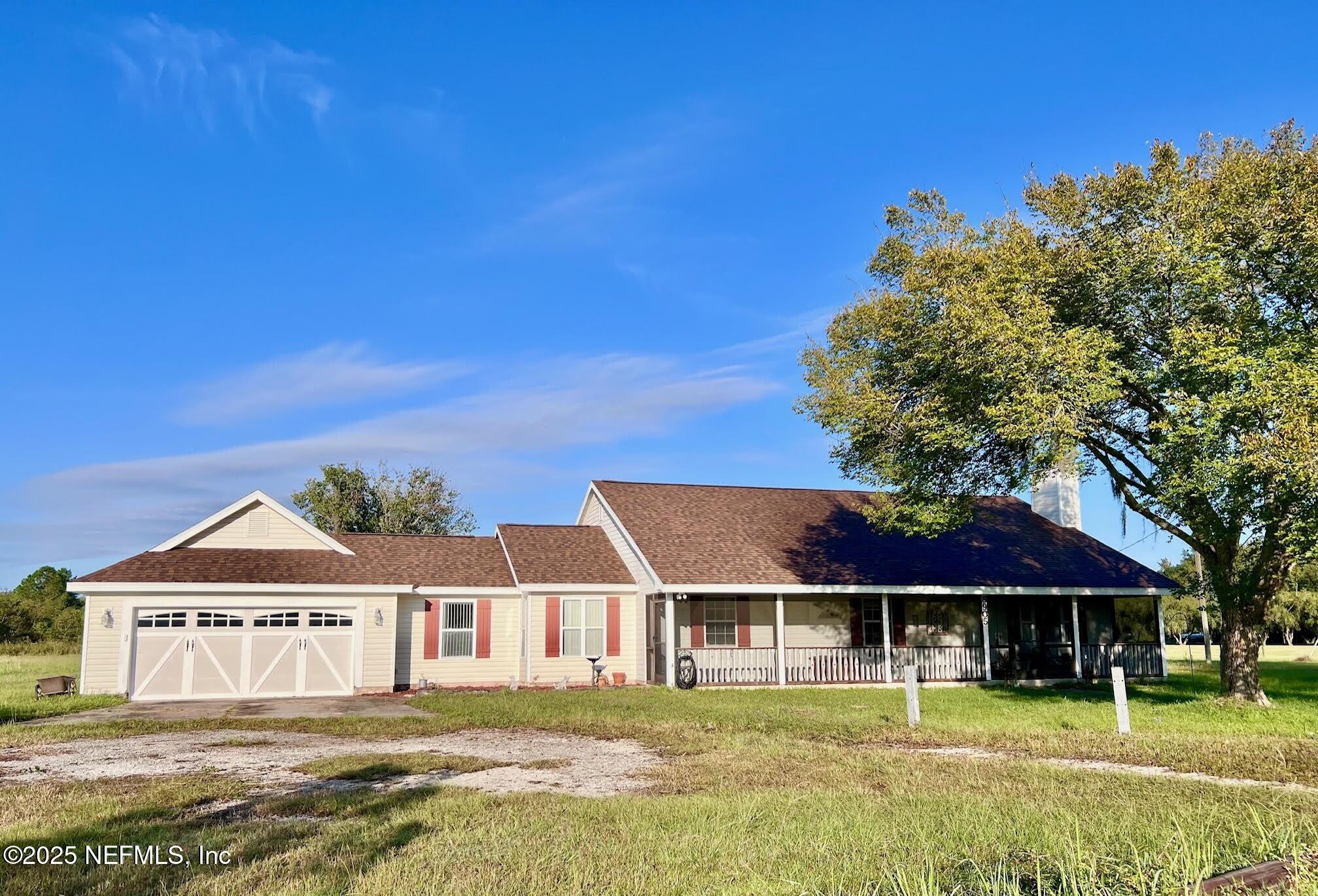 8905 Reid Packing House Road Hastings, FL 32145 - Photo 3 of 40 a front view of a house with a yard
