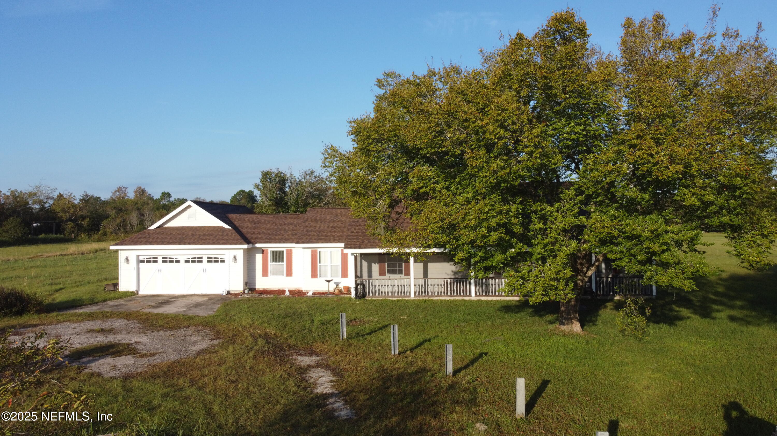 8905 Reid Packing House Road Hastings, FL 32145 - Photo 36 of 40 a view of a big yard with large trees and a small yard