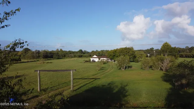 a view of a lake with a yard