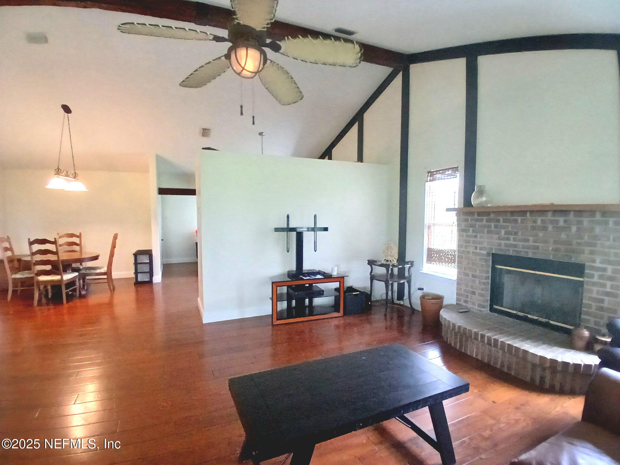8905 Reid Packing House Road Hastings, FL 32145 - Photo 10 of 40 a living room with furniture and wooden floor