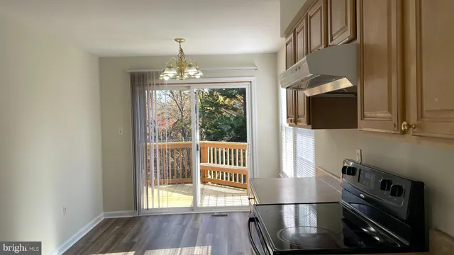a view of a kitchen from the hallway