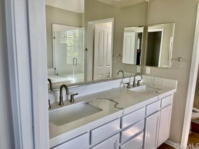 19 Avignon Newport Coast, CA 92657 - Photo 11 of 14 a bathroom with a sink and a mirror