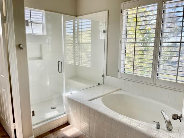 19 Avignon Newport Coast, CA 92657 - Photo 12 of 14 a bathroom with a tub a sink and a shower