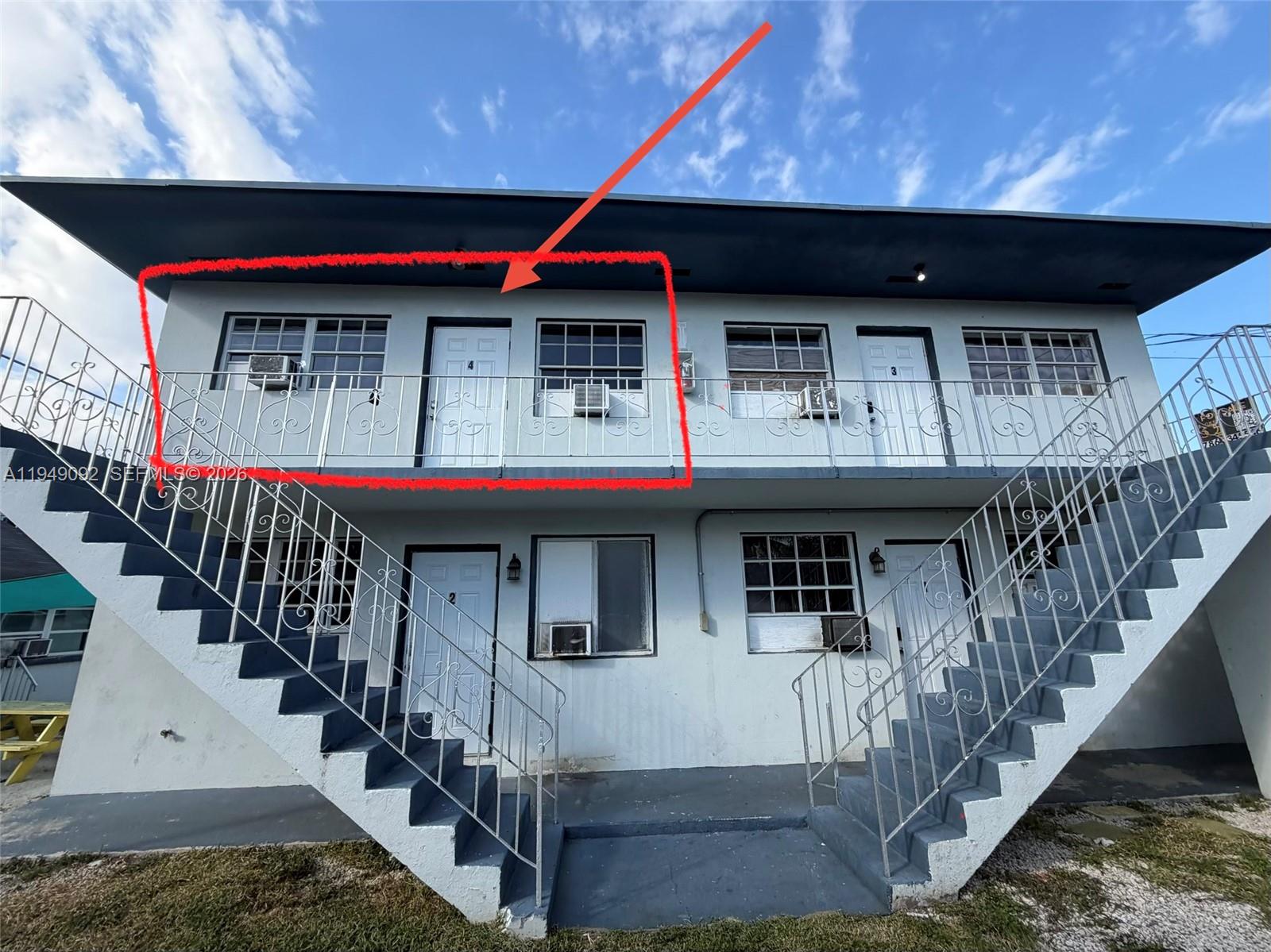 a front view of a house with deck