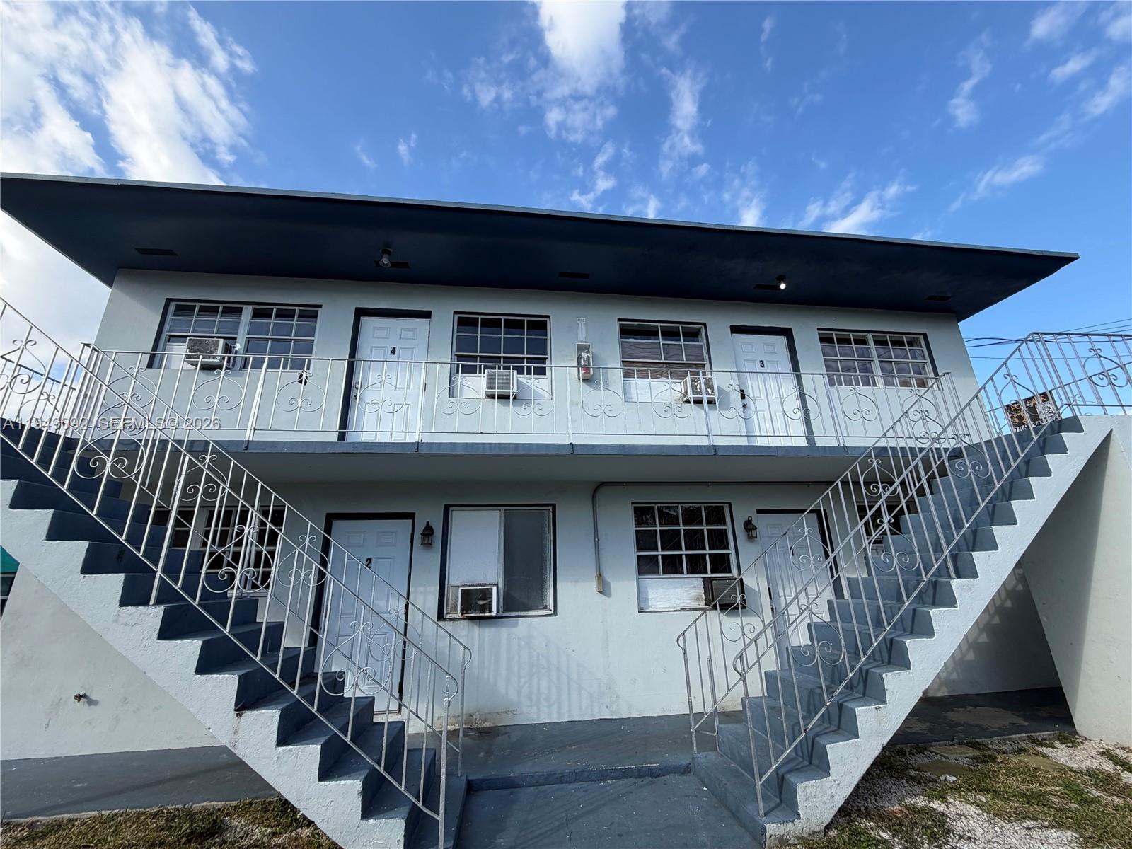 7638 North Miami Avenue, Unit 4 Miami, FL 33150 - Photo 11 of 11 a view of a house with wooden stairs