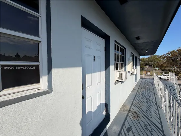 a view of a house with wooden stairs