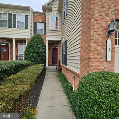 a view of a pathway with house and front view of a house
