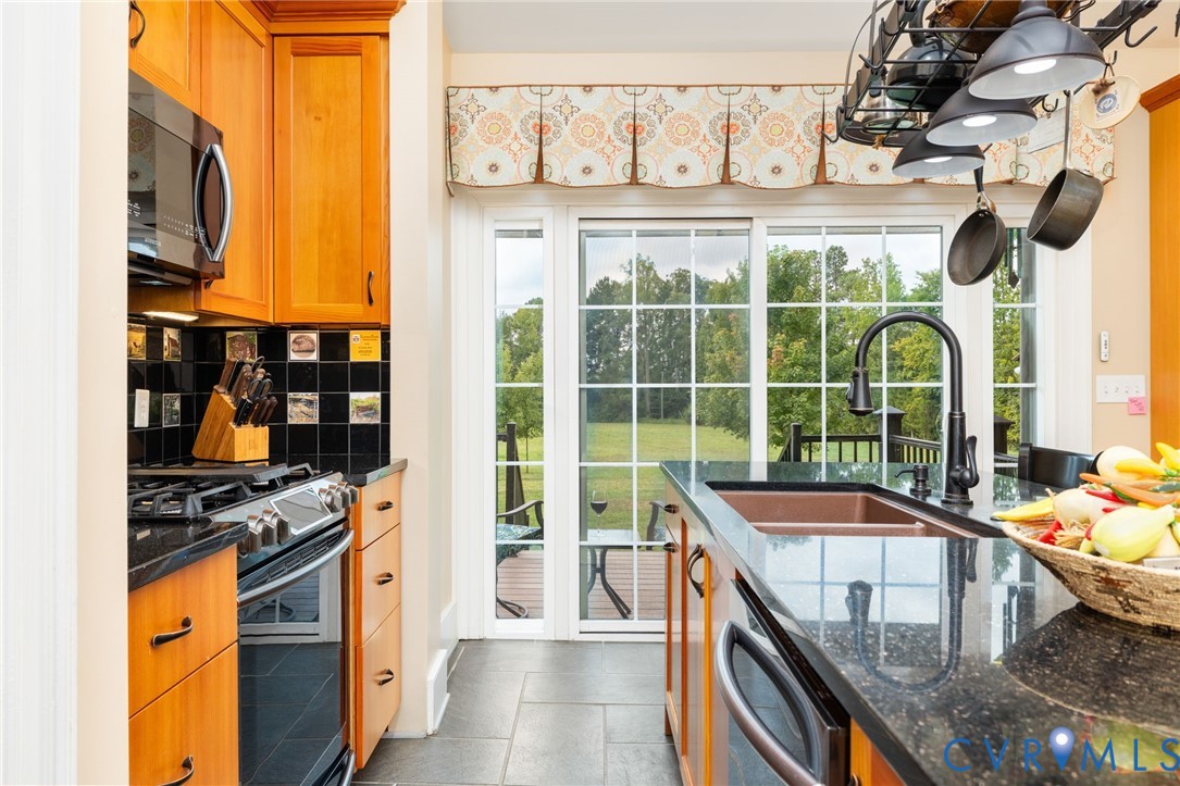 2284 Wallace's Bridge Road Lunenburg, VA 23952 - Photo 11 of 89 Kitchen featuring wood cabinetry, black countertop