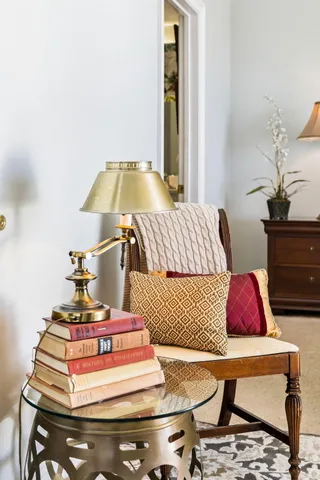 a bed sitting in a bedroom next to a window