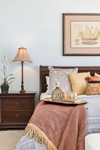 a bedroom with bed and a window