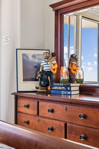 a view of a livingroom with furniture and a flat screen tv