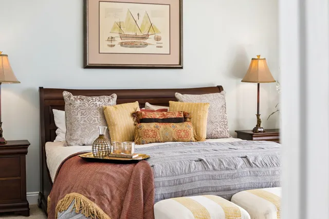 a bedroom with furniture and wooden floor