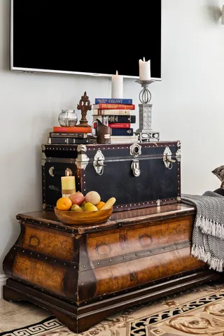 a room with gym equipment and wooden floor