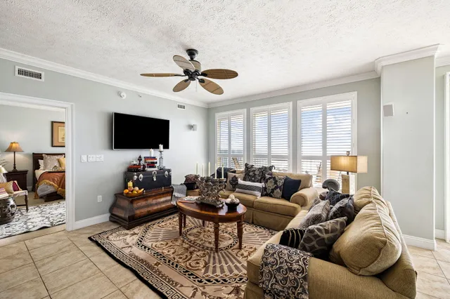 a view of a livingroom with furniture and windows