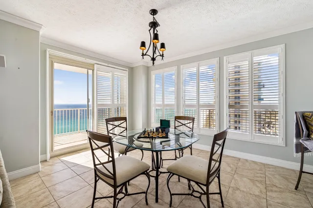 a kitchen with stainless steel appliances granite countertop a sink a stove a microwave and wooden cabinets