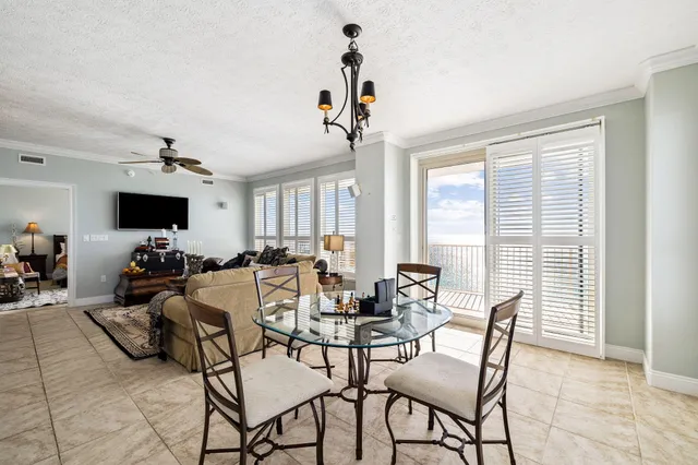 a kitchen with granite countertop white cabinets and a stove top oven