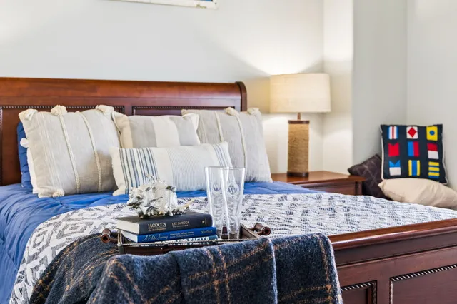 a living room with furniture and painting on the wall