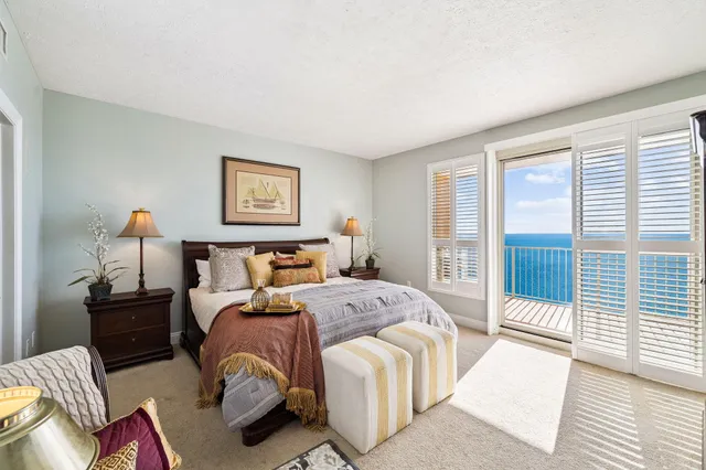 a bedroom with a bed and lamp