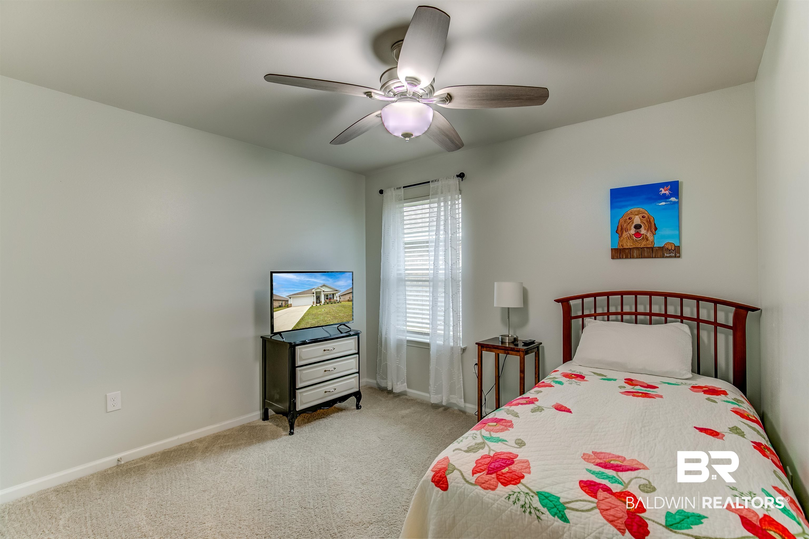 8033 Irwin Loop Daphne, AL 36526 - Photo 31 of 38 Interior room featuring light gray walls, carpet flooring, and a ceiling fan with integrated lighting