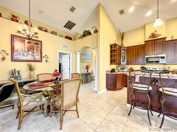 a large kitchen with stainless steel appliances lots of counter space