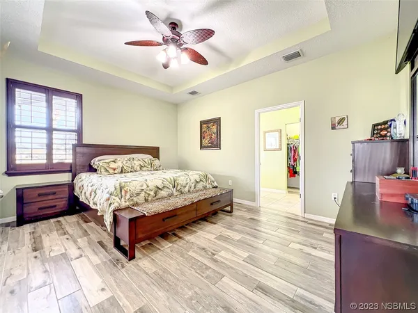 a bathroom with a sink a mirror and a shower