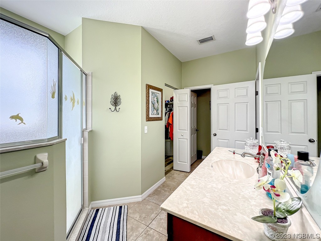 407 Northstar Lane Edgewater, FL 32141 - Photo 28 of 47 a very nice looking room with a large bed