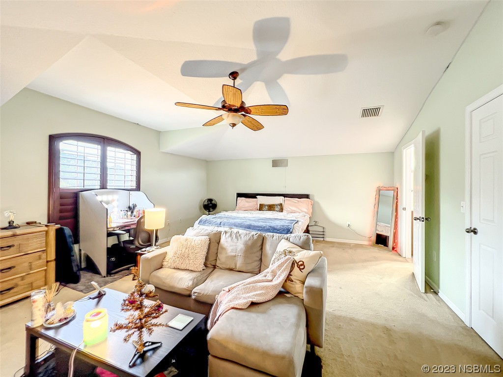 407 Northstar Lane Edgewater, FL 32141 - Photo 31 of 47 a bedroom with a bed and wooden floor