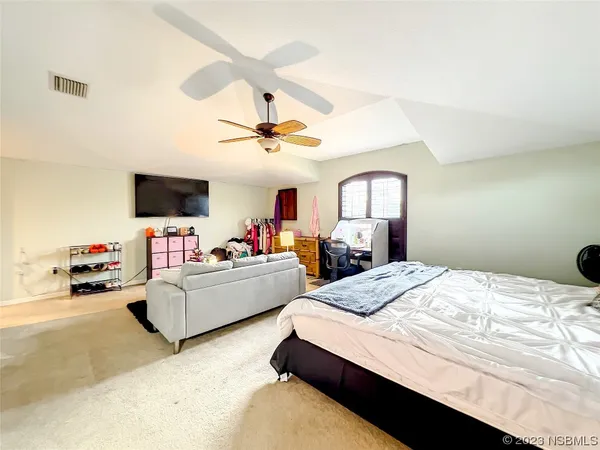 a view of a patio with a table chairs and a backyard