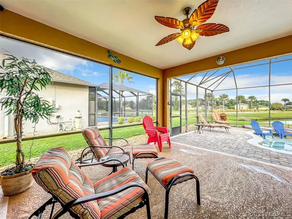 a view of a swimming pool with a back yard