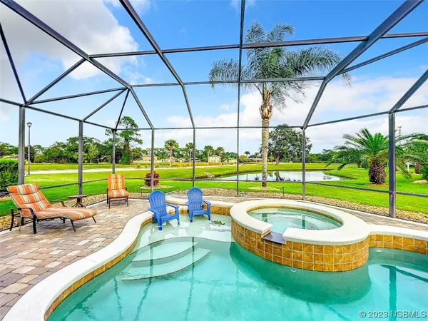 a view of swimming pool with a patio