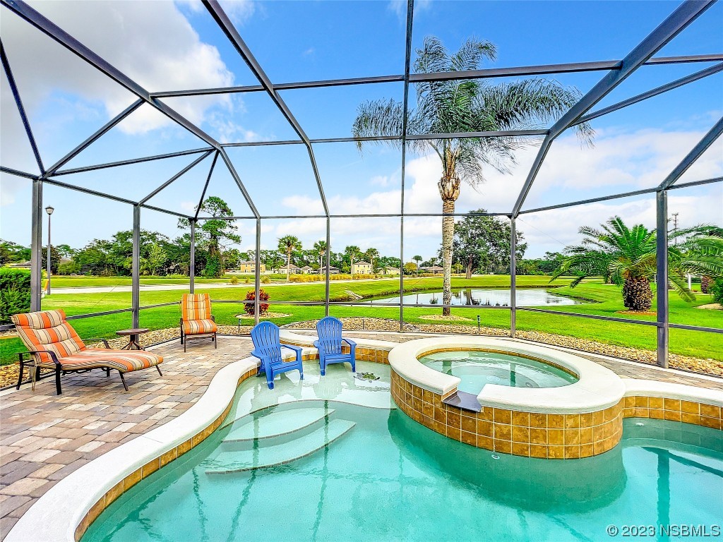 407 Northstar Lane Edgewater, FL 32141 - Photo 38 of 47 a view of a swimming pool with a back yard