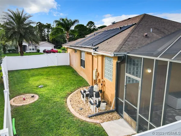 a front view of a house with patio and garden