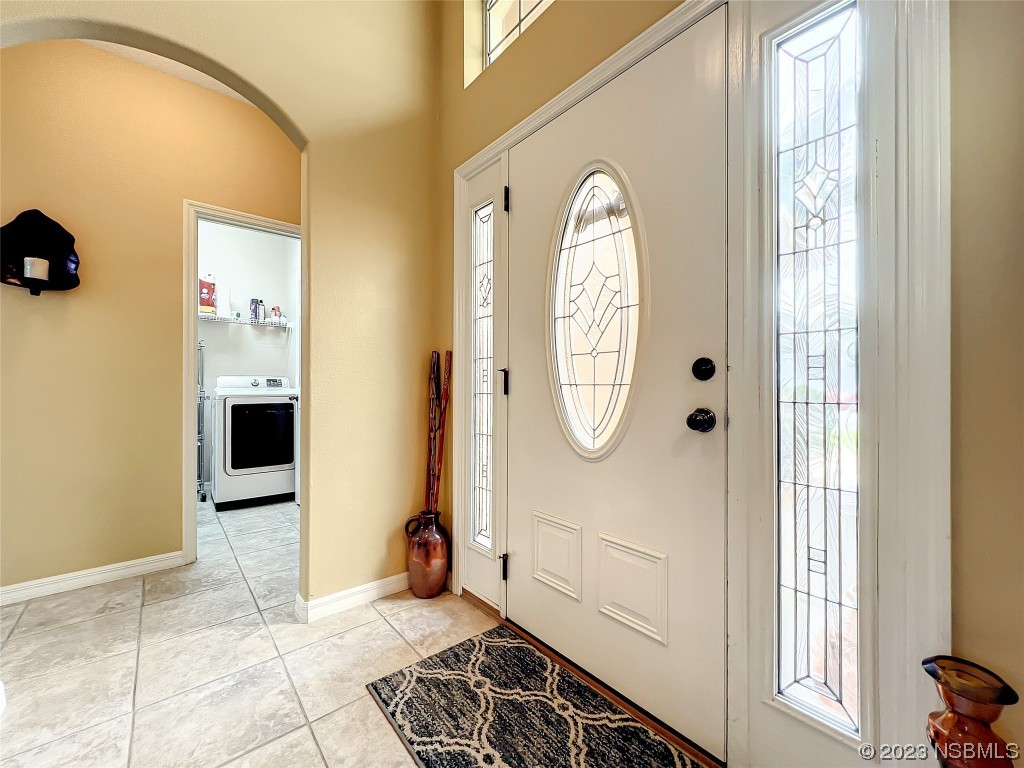 407 Northstar Lane Edgewater, FL 32141 - Photo 7 of 47 a view of a entryway door with wooden floor